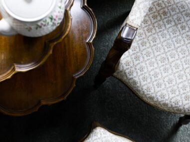 downward view of chair and table with teapot